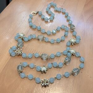 Light blue and gold tone necklace.